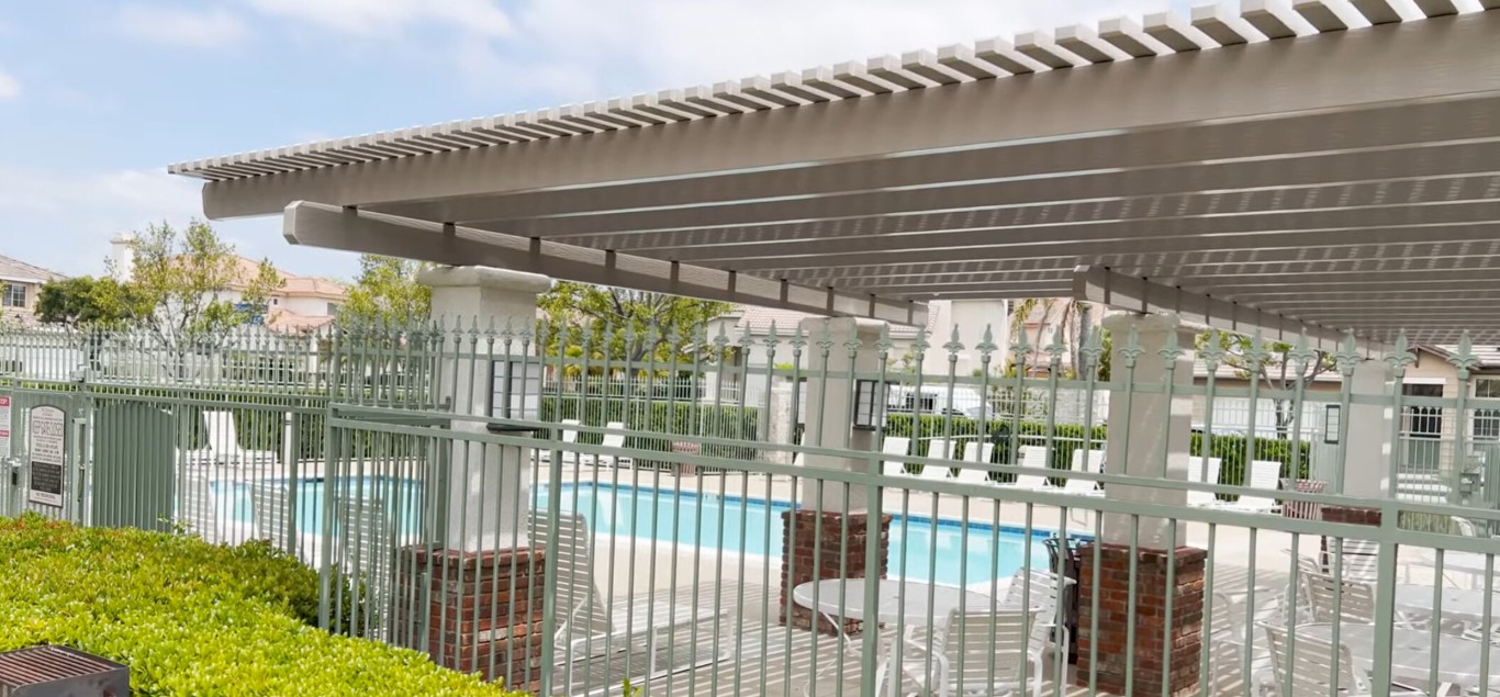 Safety-compliant pool fence surrounding residential swimming pool