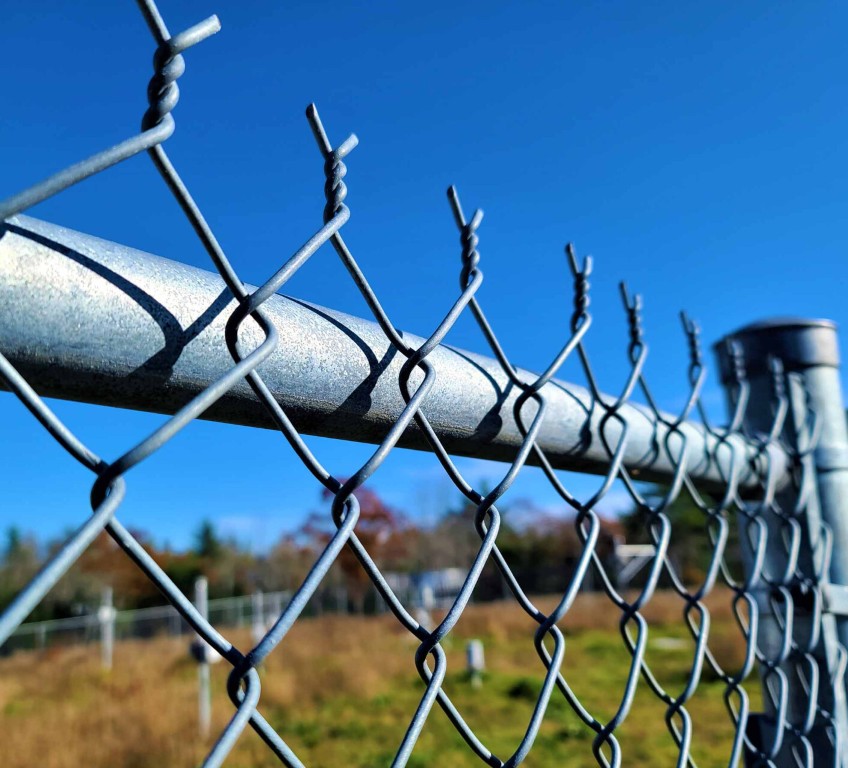 Heavy-duty chain-link fence installation for security